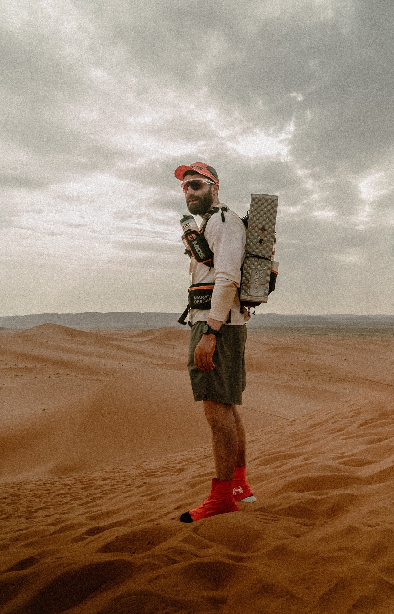 Tyler looking out over Sahara with his supplies