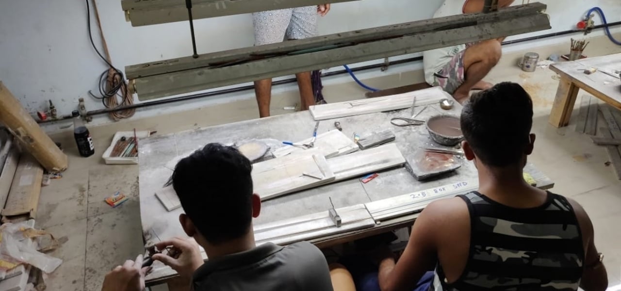 Boys working in factory