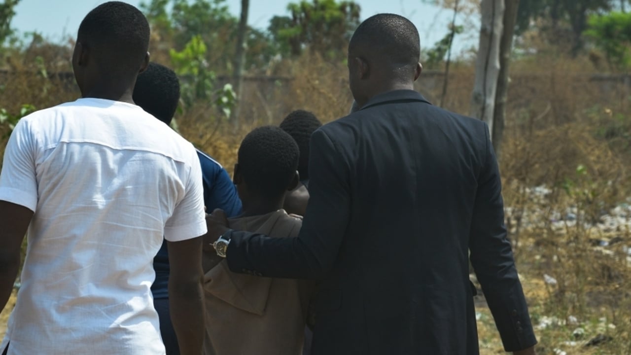01 31 A victim being escorted by partners