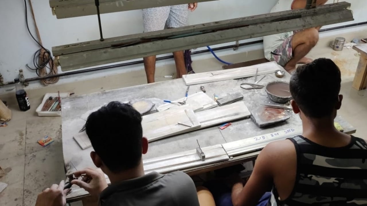 Boys working in factory
