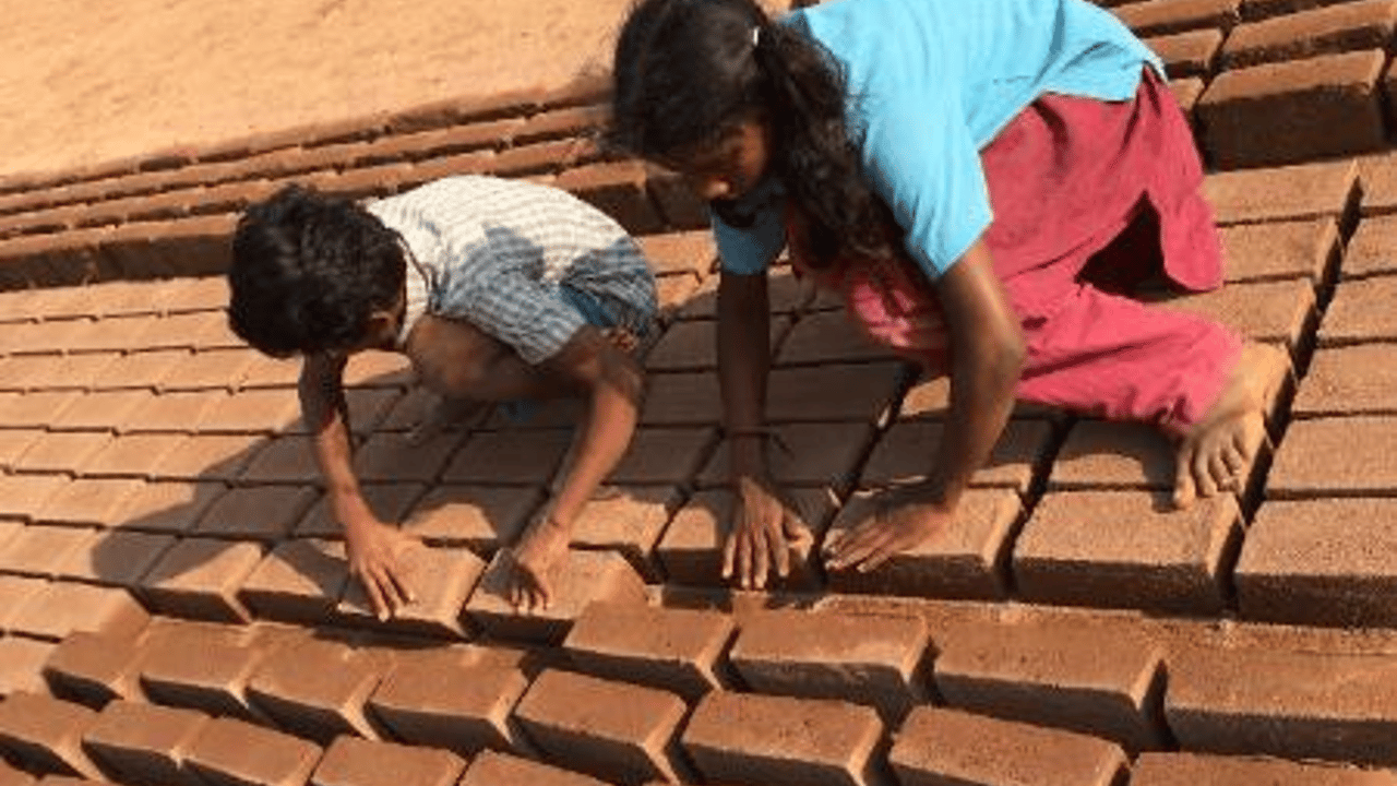Children drying bricks
