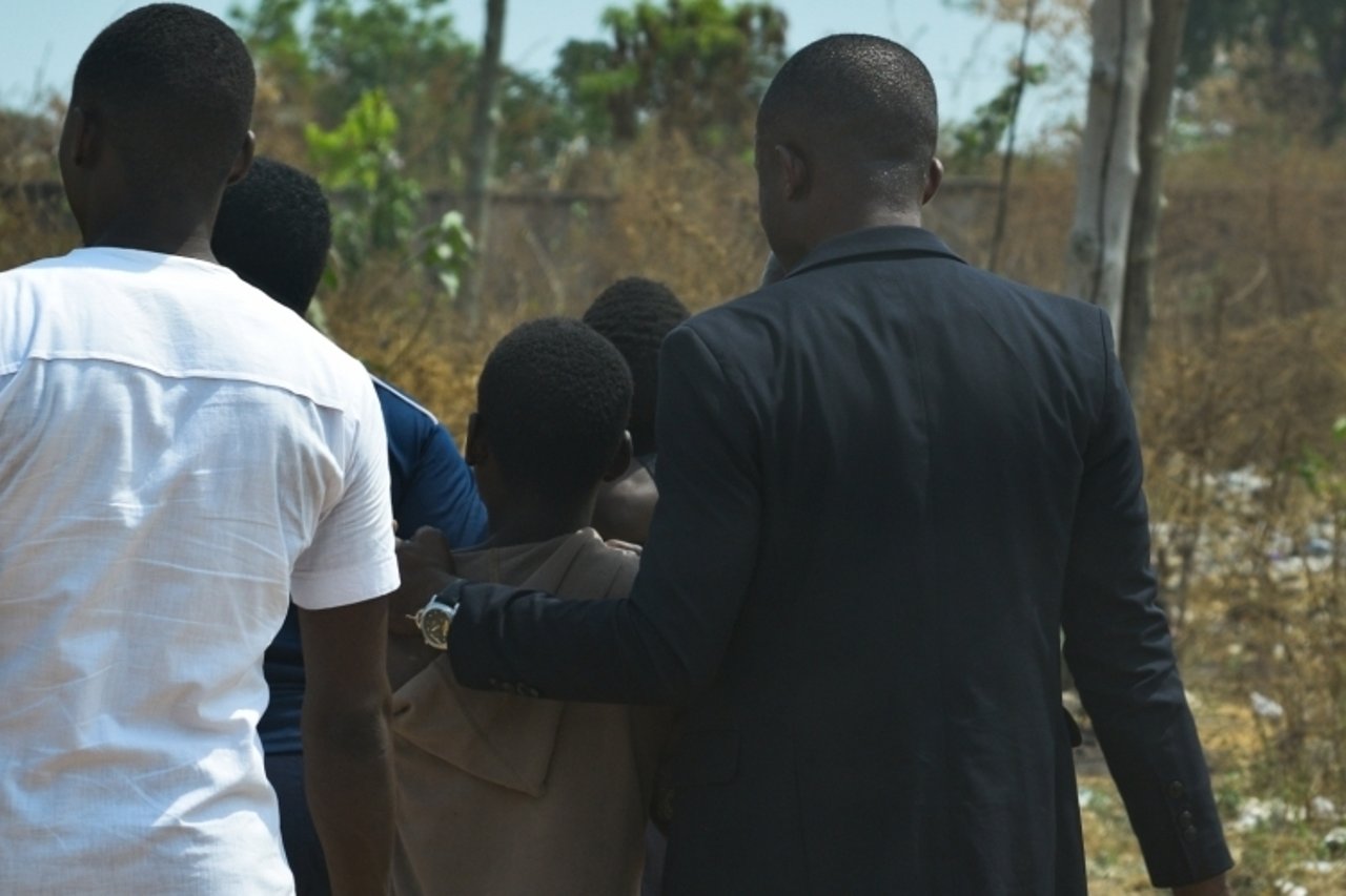 01 31 A victim being escorted by partners