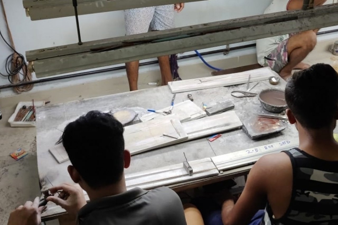 Boys working in factory