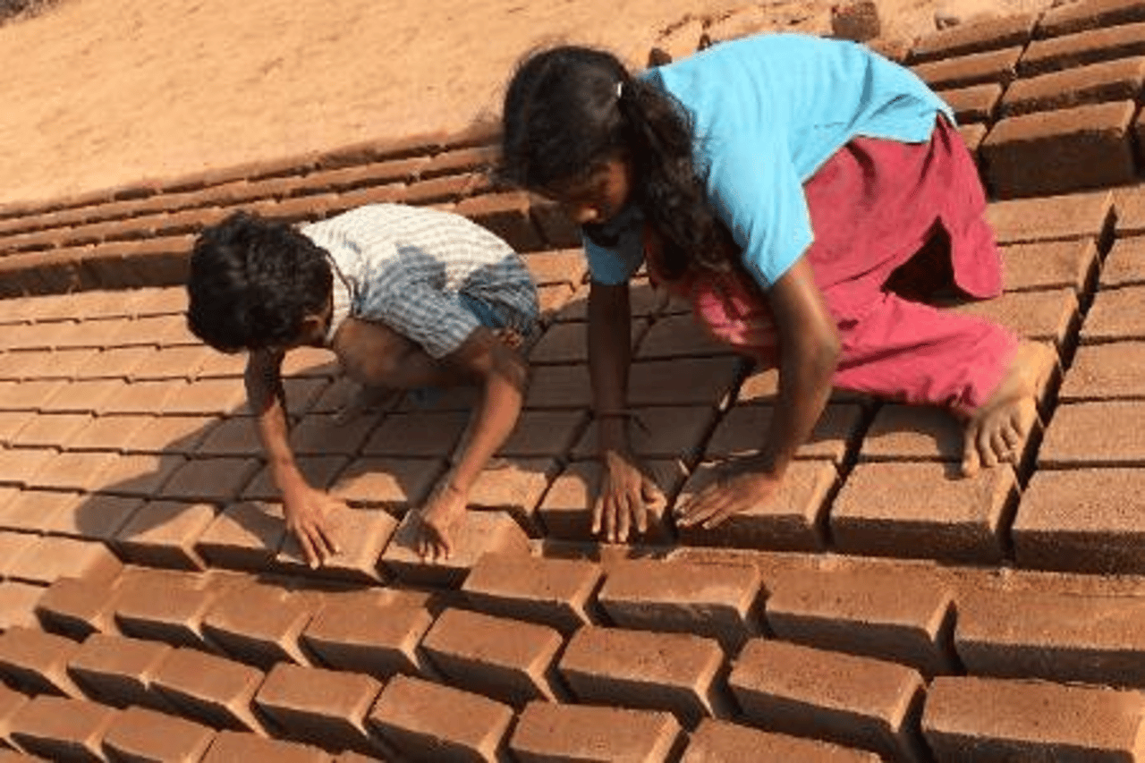Children drying bricks