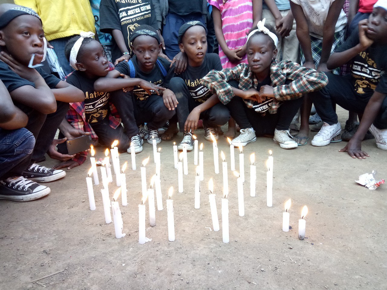 Candlelight vigil held at the Justice Center to honor Willie Joseph and Josephat Copy jpg 20180623 NAI PAP 2 Year Memorial WJJ Approved for Full Use